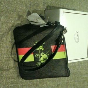 Signature print brown Coach wristlet